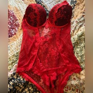 Red lingerie bodysuit by Daisy Fuentes